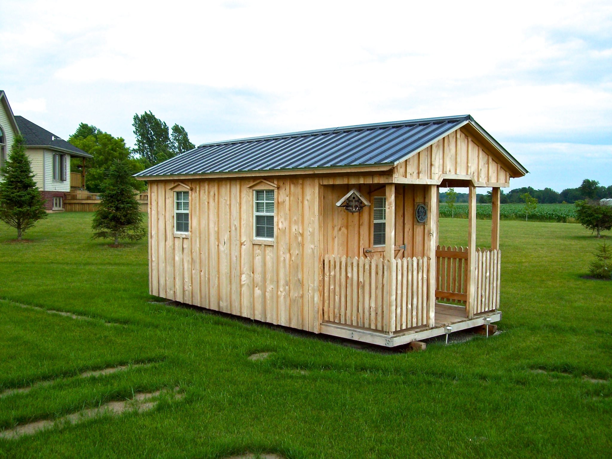 Amish Shed with porch and green roof